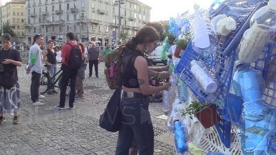Scene from Clima, azione di Fridays For Future Milano: una balena di piantine e bottiglie in piazza XXIV maggio
