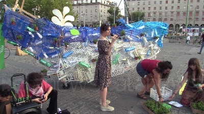 Scene from Clima, azione di Fridays For Future Milano: una balena di piantine e bottiglie in piazza XXIV maggio