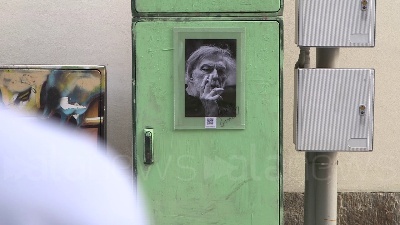 Scene from "Grazie Gino", a Milano fiori e una foto in onore del fondatore di Emergency