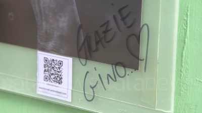 Scene from "Grazie Gino", a Milano fiori e una foto in onore del fondatore di Emergency
