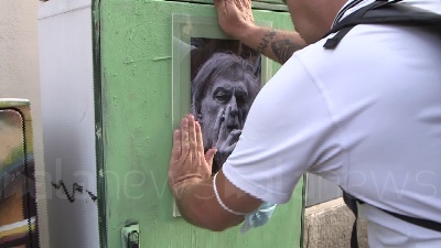 Scene from "Grazie Gino", a Milano fiori e una foto in onore del fondatore di Emergency