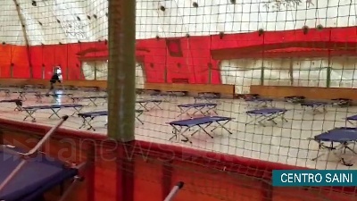 Scene from Coronavirus, centro sportivo Saini di Milano ricovero per senzatetto