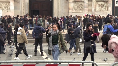 Scene from ARCHIVIO - Dicembre 2018, Milano: Duomo + persone di colore + Inter store