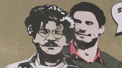 Scene from Il murales di Regeni che abbraccia Zaki a due passi dal consolato egiziano